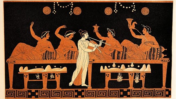 Ancient Greek-style painting of women playing musical instruments and dancing, with wine and grapes.