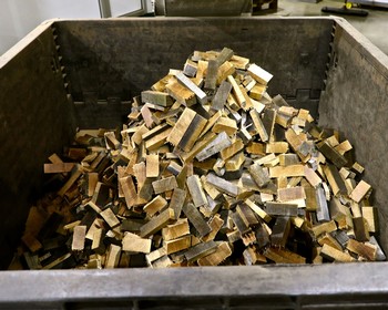 Grape sorting process at Lodi Winegrape Commission with a large container of sorted grapes.