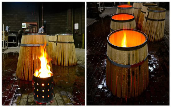 Wooden wine barrels with fire pits inside, used for wine tasting events in Lodi, California.