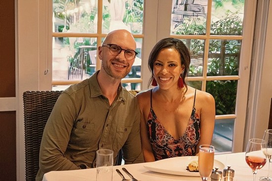 Smiling man and woman at a dining table during a Lodi Winegrape Commission event.