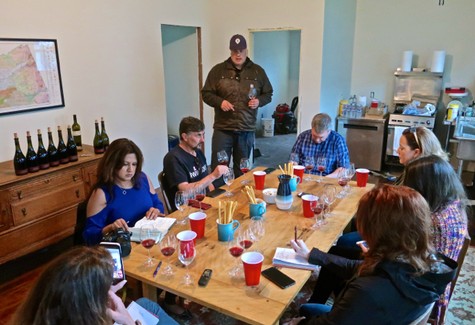 Group of people in a meeting room discussing winegrapes at Lodi Winegrape Commission event.