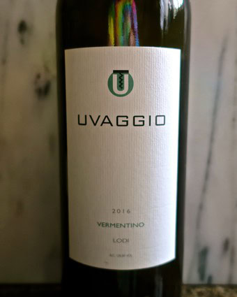 Uvaggio 2016 Vermentino wine bottle from Lodi, California, with a minimalist white label and green logo.