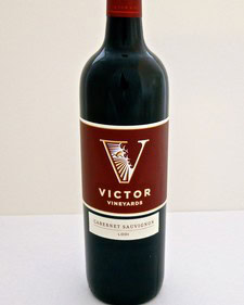 Bottle of Victor Vineyards Cabernet Sauvignon wine from Lodi, California, with a red and white label.