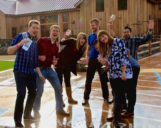Group of friends celebrating with wine outdoors at Lodi Winegrape Commission event.