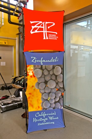 Zinfandel grapes and promotional banner for California's heritage wine at Lodi Wine event.