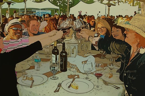 Group of people enjoying wine and food at a Lodi Winegrape Commission event outdoors.
