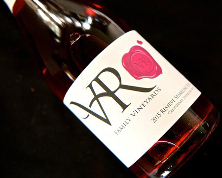 Lodi Winegrape Commission wine bottle with label and red wax seal, 2015 vintage, on black background.